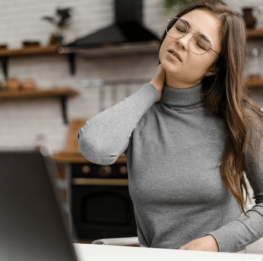 young-woman-having-neckache-while-working-from-home_23-2148813145 young-woman-having-neckache-while-working-from-home_23-2148813145